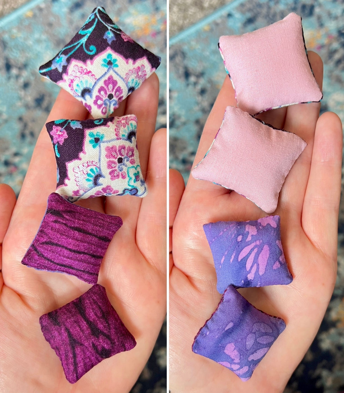 Small fabric pillows in various patterns held in a hand.