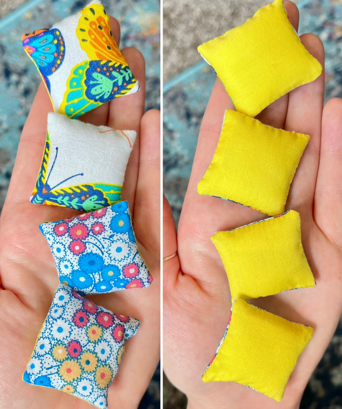 Colorful fabric pillows held in hands with a plain background