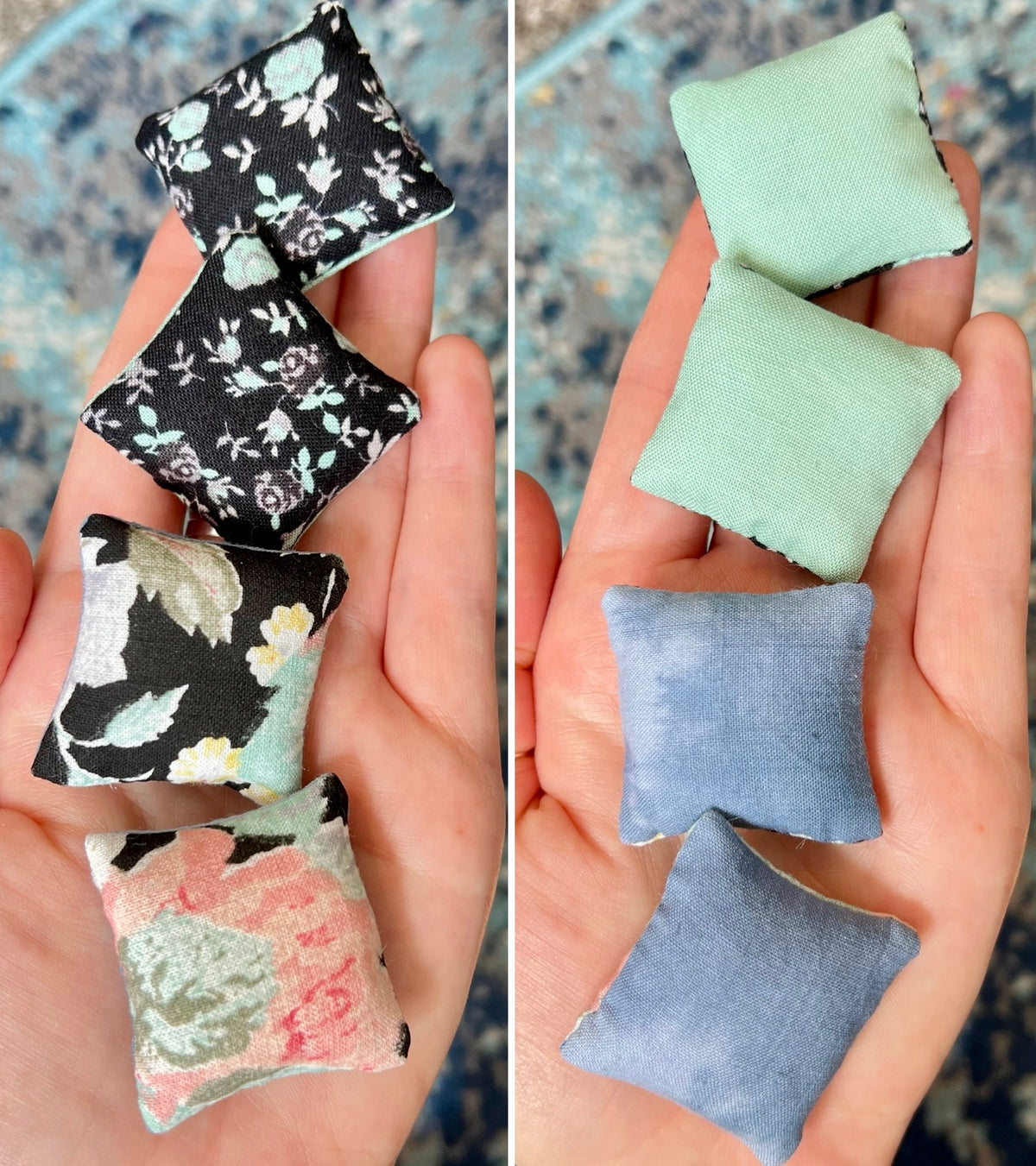 Two sets of small fabric pillows held in hands, one set with floral patterns and the other with solid colors.