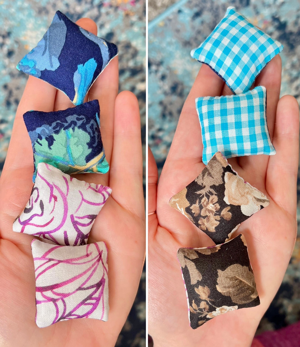 Miniature fabric pillows in various patterns held in hands.
