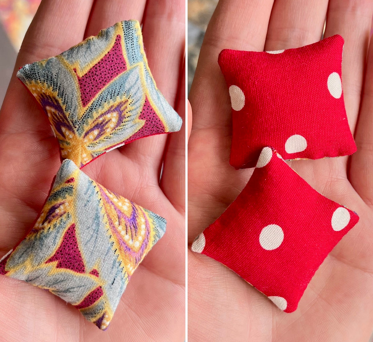 Two fabric pillows, front with a butterfly pattern and the back with red and white polka dots, held in hands.