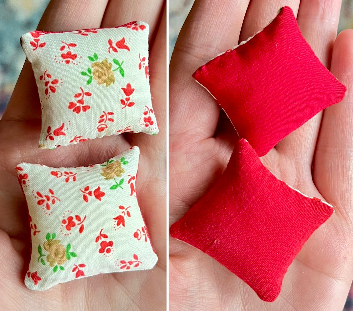 Two small fabric pillows, front with floral pattern and back solid red, held in hands.