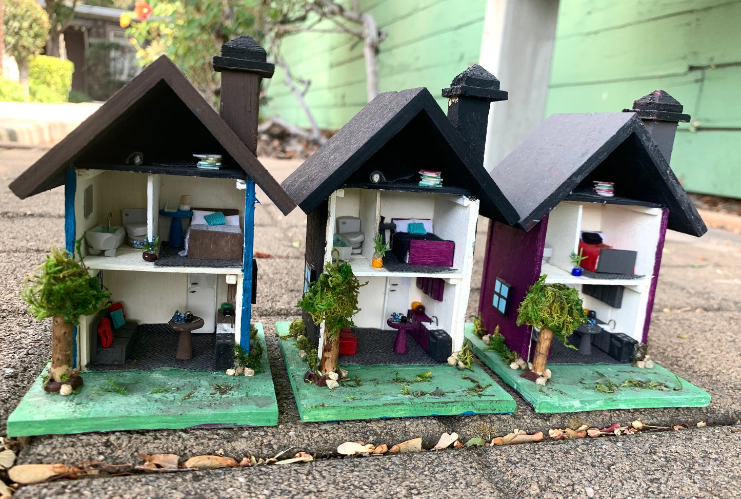 A row of tiny dollhouses