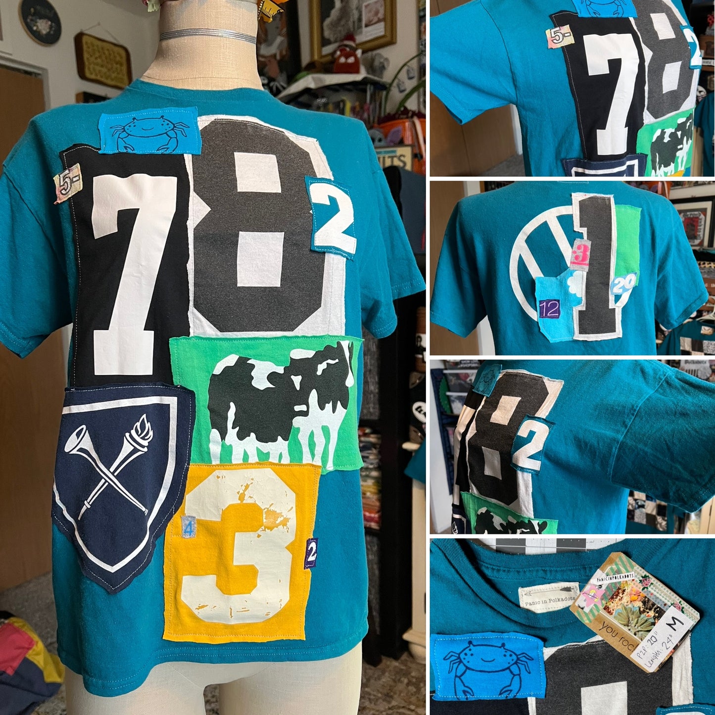 Teal t-shirt with various designs including numbers and animals on a mannequin.