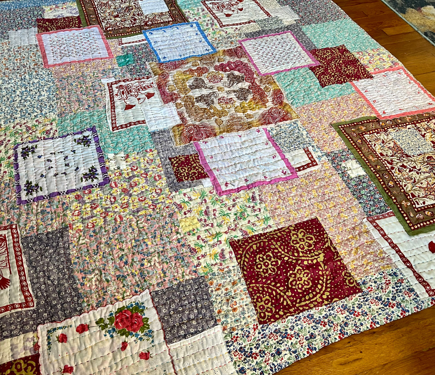 aerial side view of vintage floral feedsack quilt