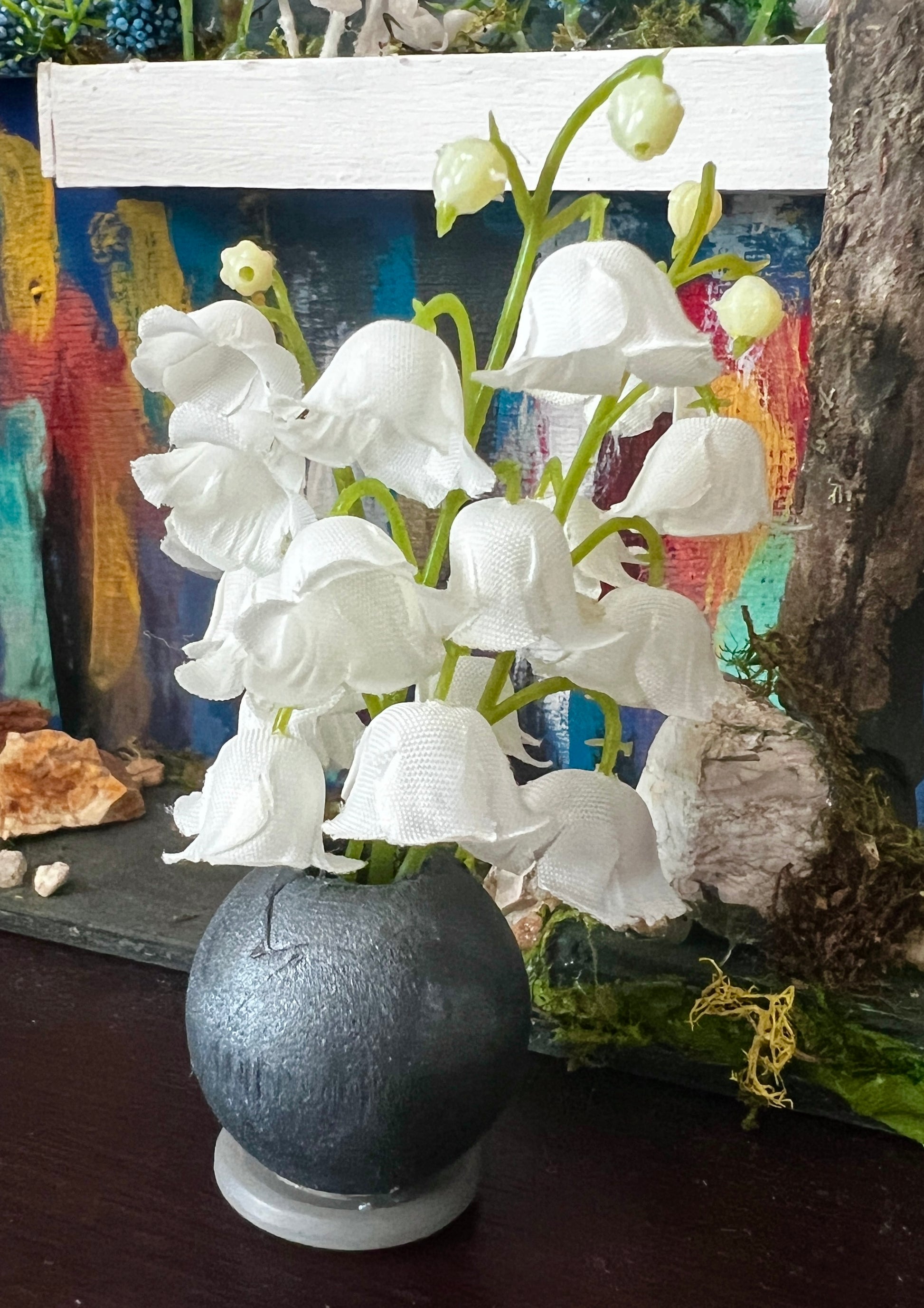 black vase white bell flowers