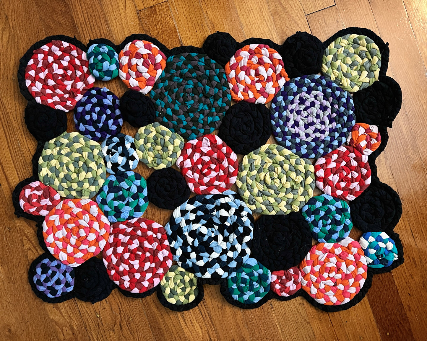 colorful rug on top of a wood floor background