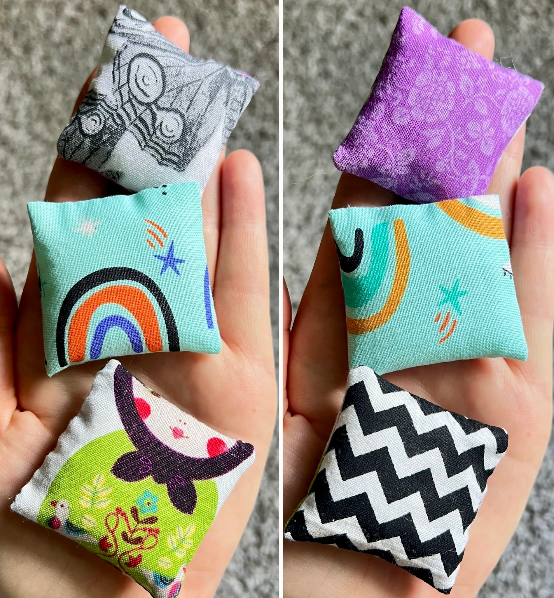 Colorful fabric pillows held in hands with various patterns.