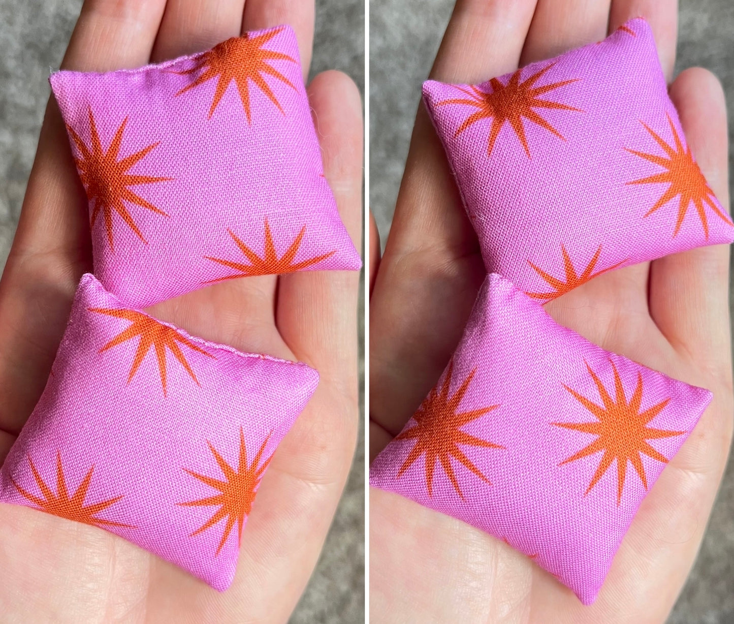 Two pink fabric doll pillows with orange star patterns held in hands against a neutral background