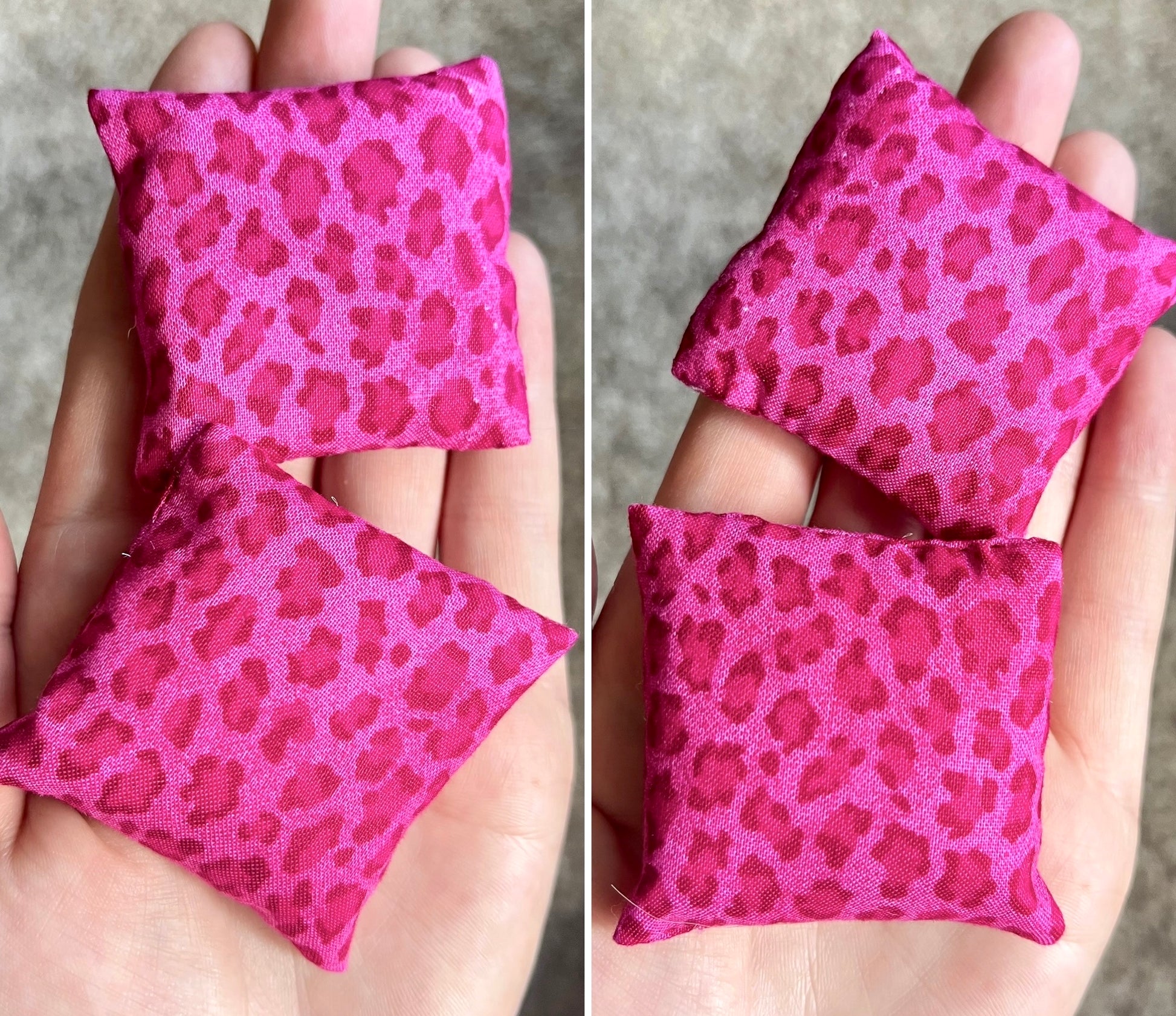 Two pink fabric doll pillows with leopard print pattern held in a hand.