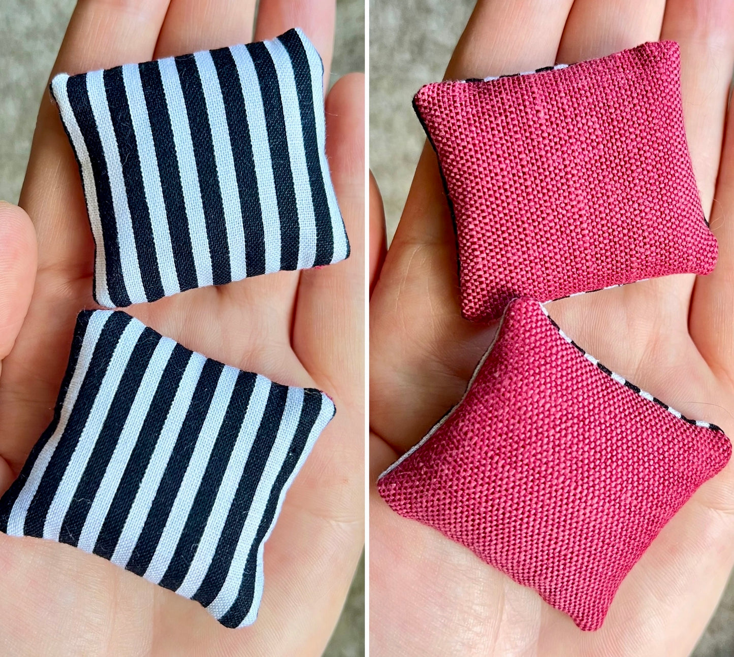 Two small fabric pillows, front is black and white striped, the back is magenta pink, held in hands.
