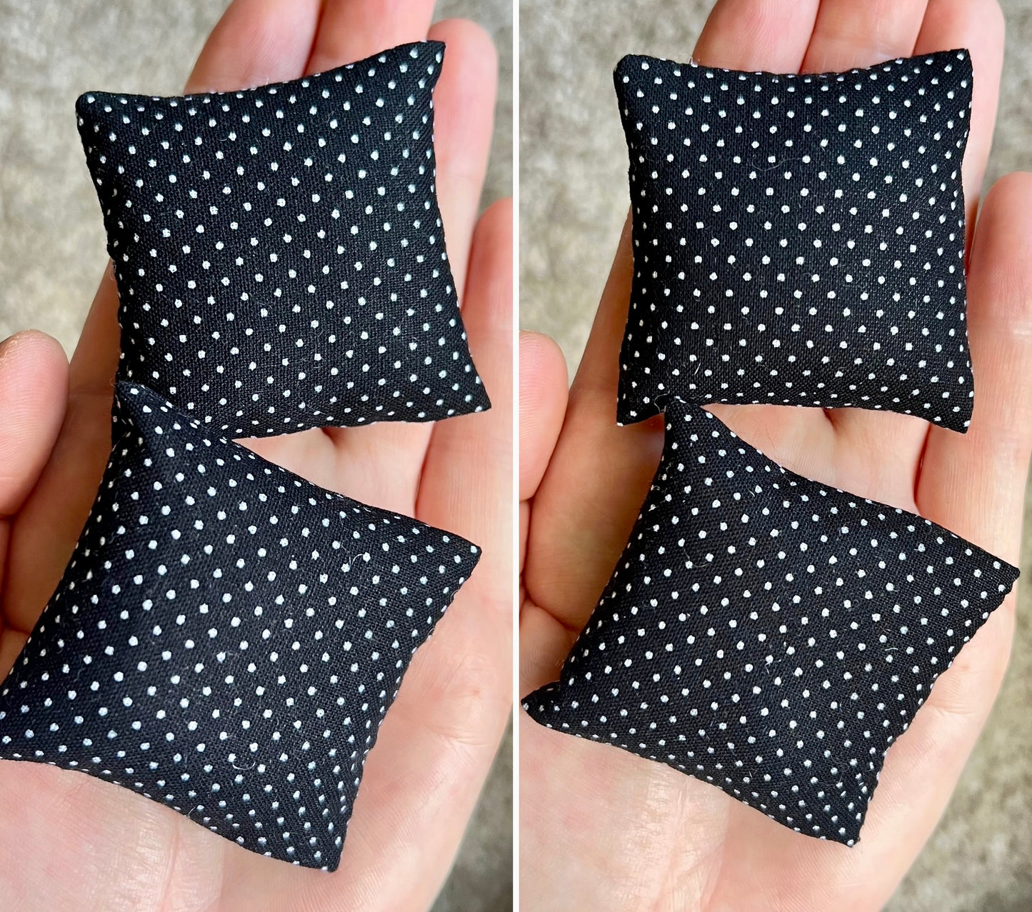 Two black pillows with white polka dots held in hands against a neutral background