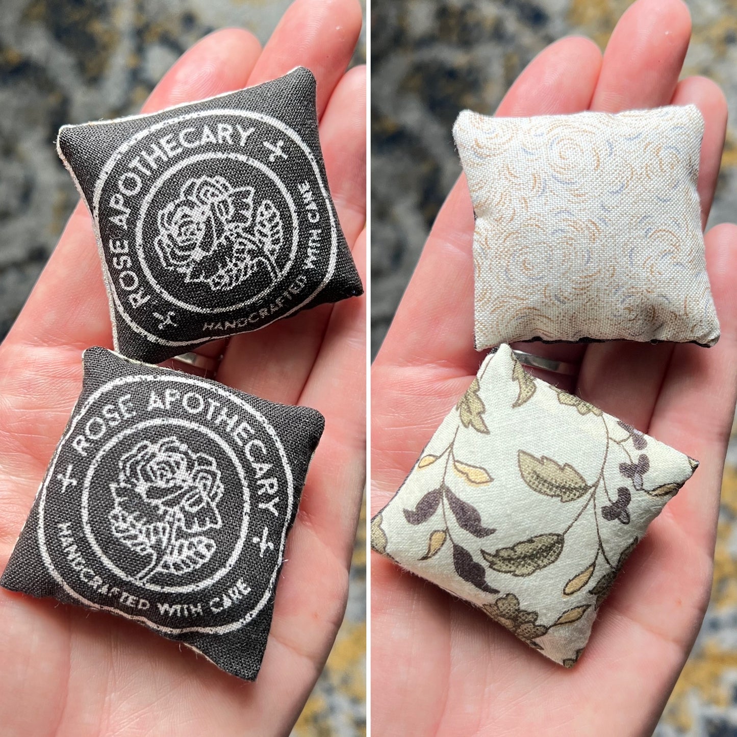 Two small fabric pillows with 'Rose Apothecary' on the front, and different ivory patterns on the backs, held in hands.
