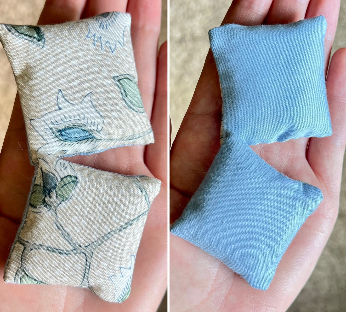 Two fabric pillows, front with floral pattern and back with solid blue, held in hands.
