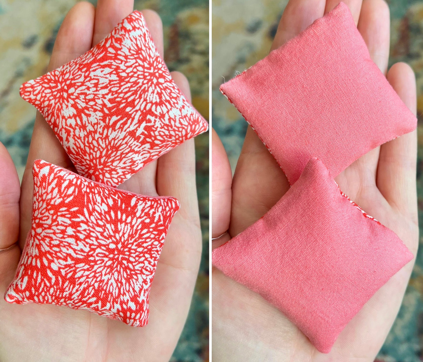 Two small fabric pillows, the front is a salmon and white pattern and the back solid pink, held in hands against a blurred background.