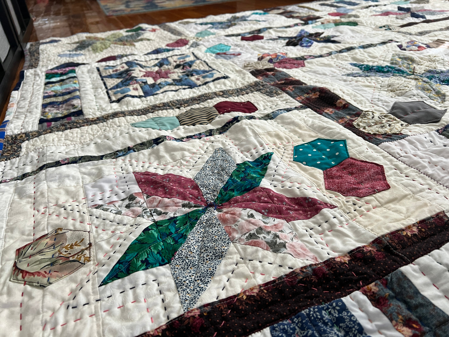 eight point stars and quilted hexies quilt, closeup