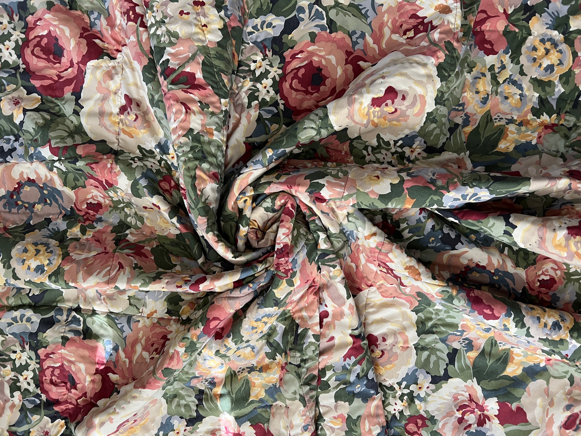 back of quilt, which is a vintage rose floral sheet, also swirled for texture