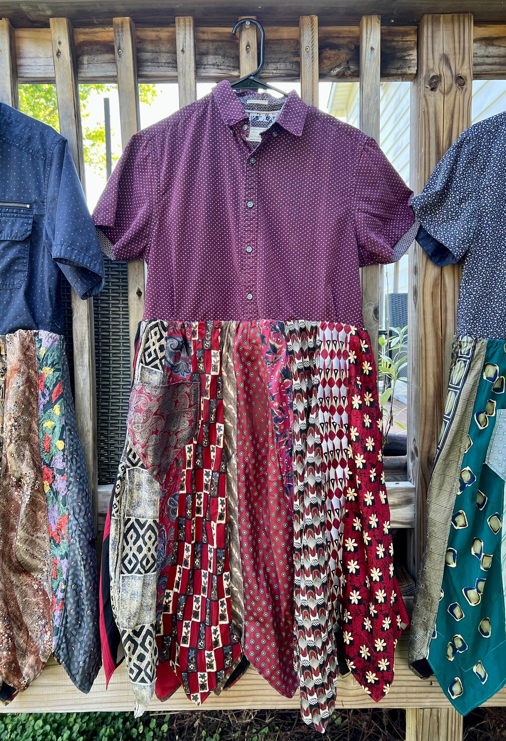 Shirtdresses all in a row, with focus on maroon necktie shirtdress