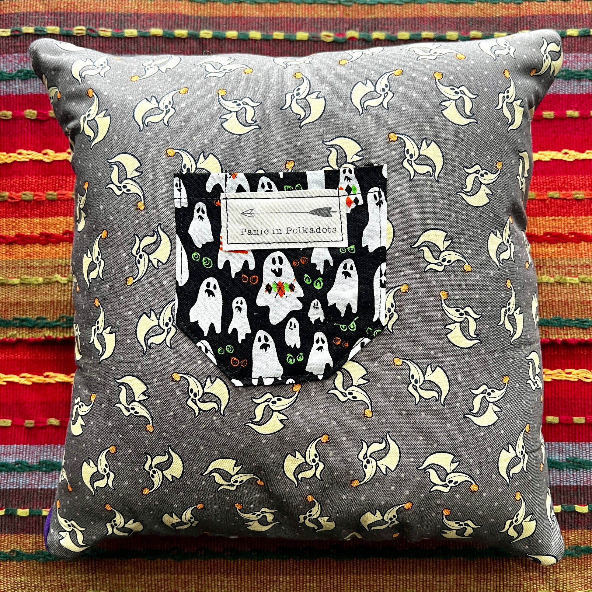 back view of nightmare before christmas cathedral square pillow, with zero and ghosties pocket