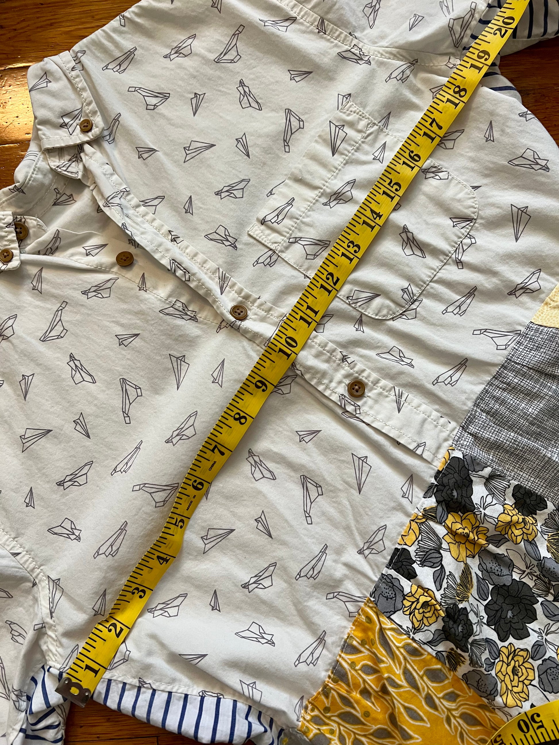 paper airplanes shirtdress with measuring tape across chest