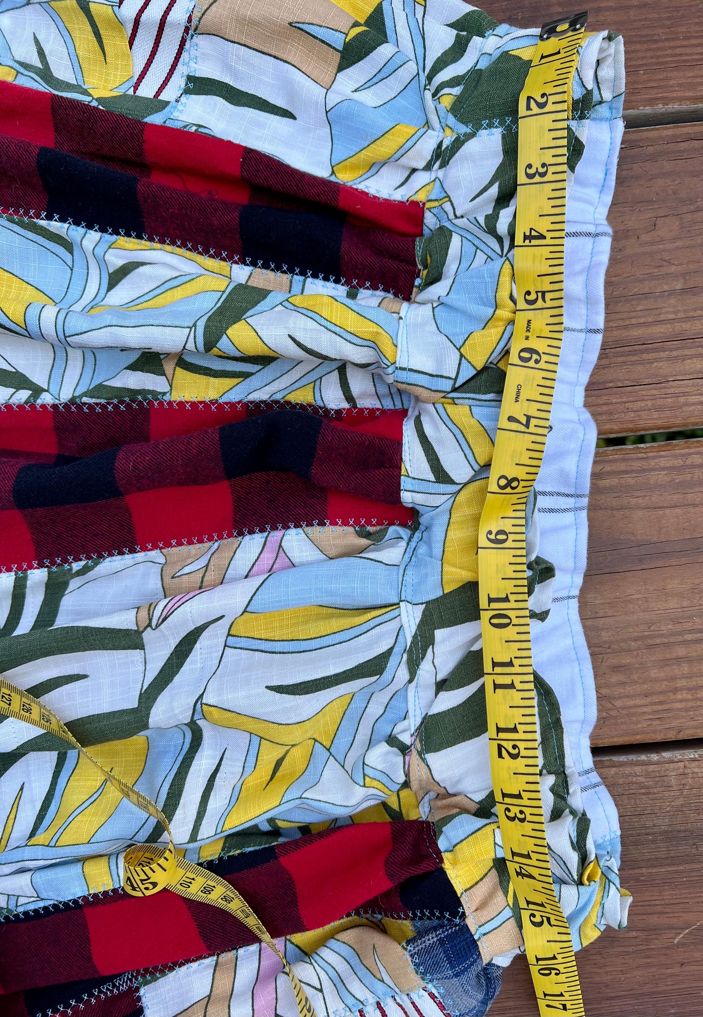 plaid patchwork skirt waist closeup with measuring tape across elastic waist hem