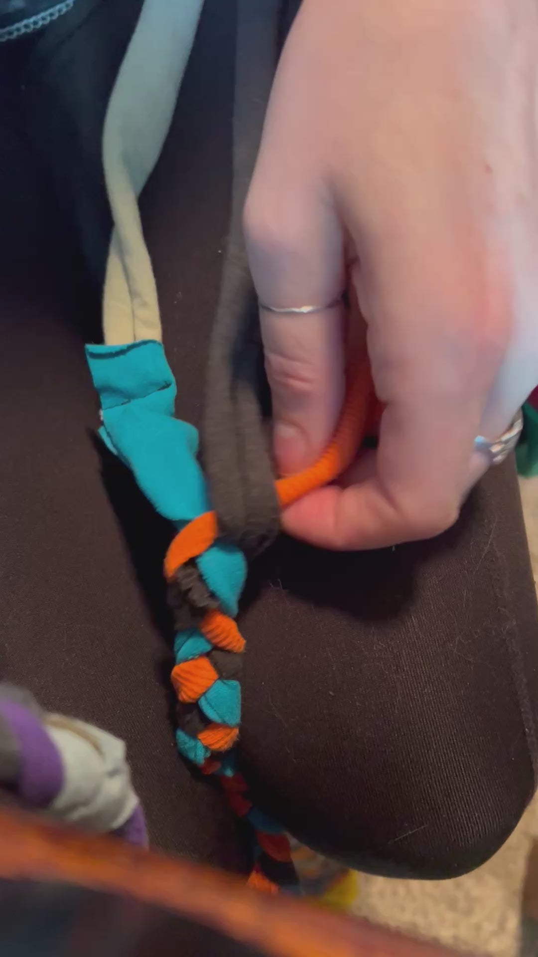 Braiding together tshirt strips to make into trivets and rugs