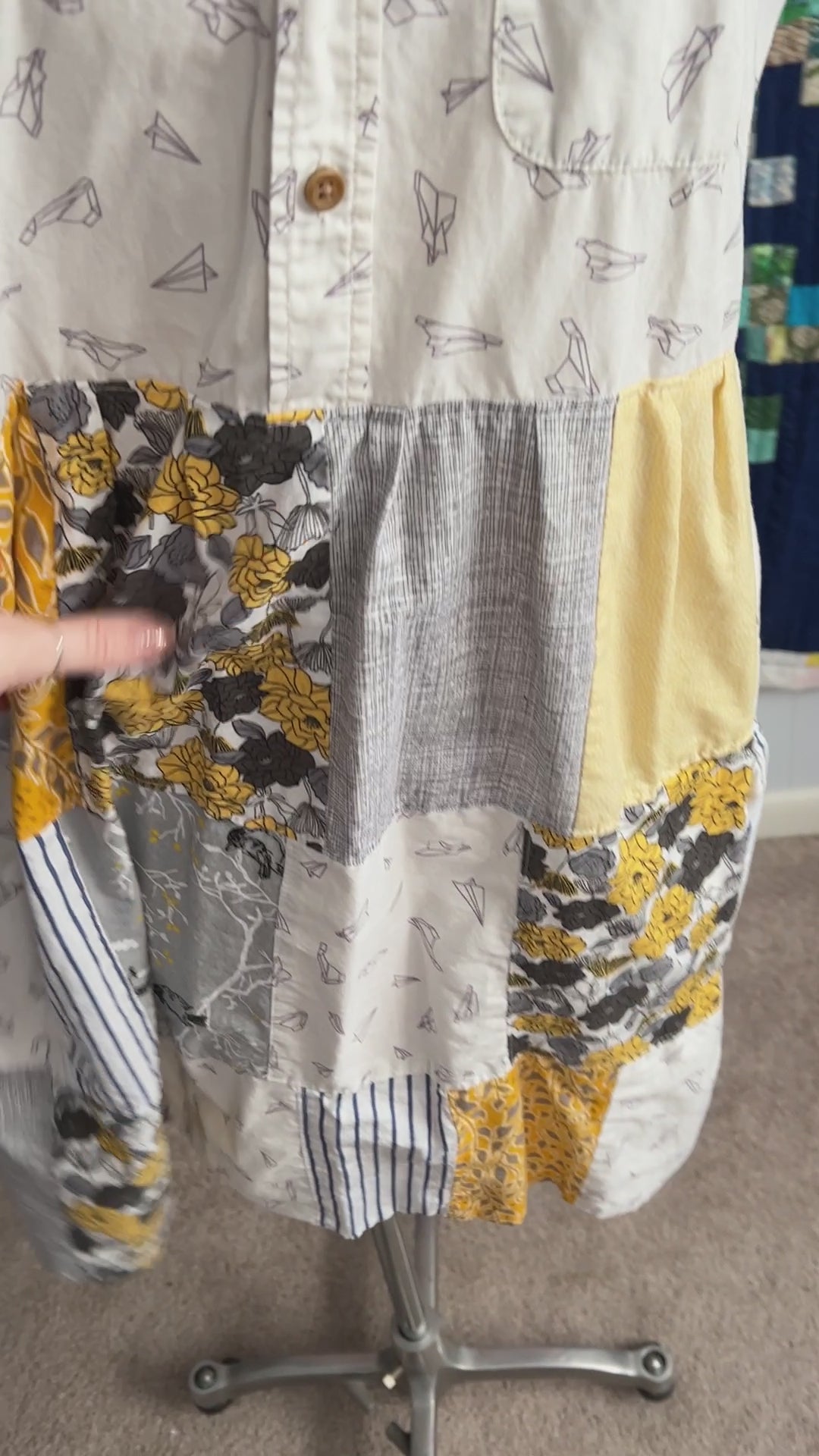 a video showing details and movement of yellow shirtdress