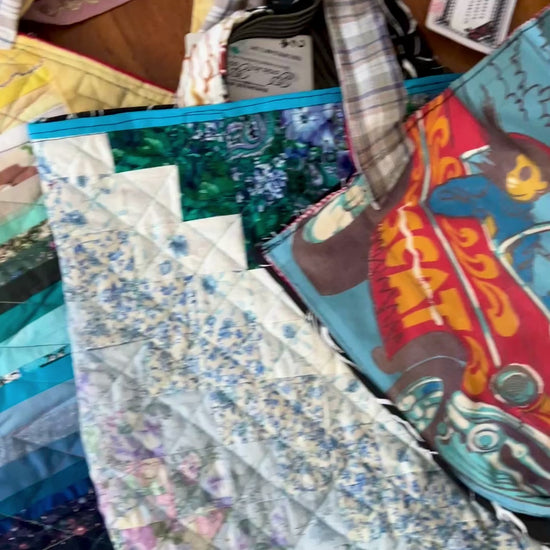 aerial view of quilty tote bags against a wood background