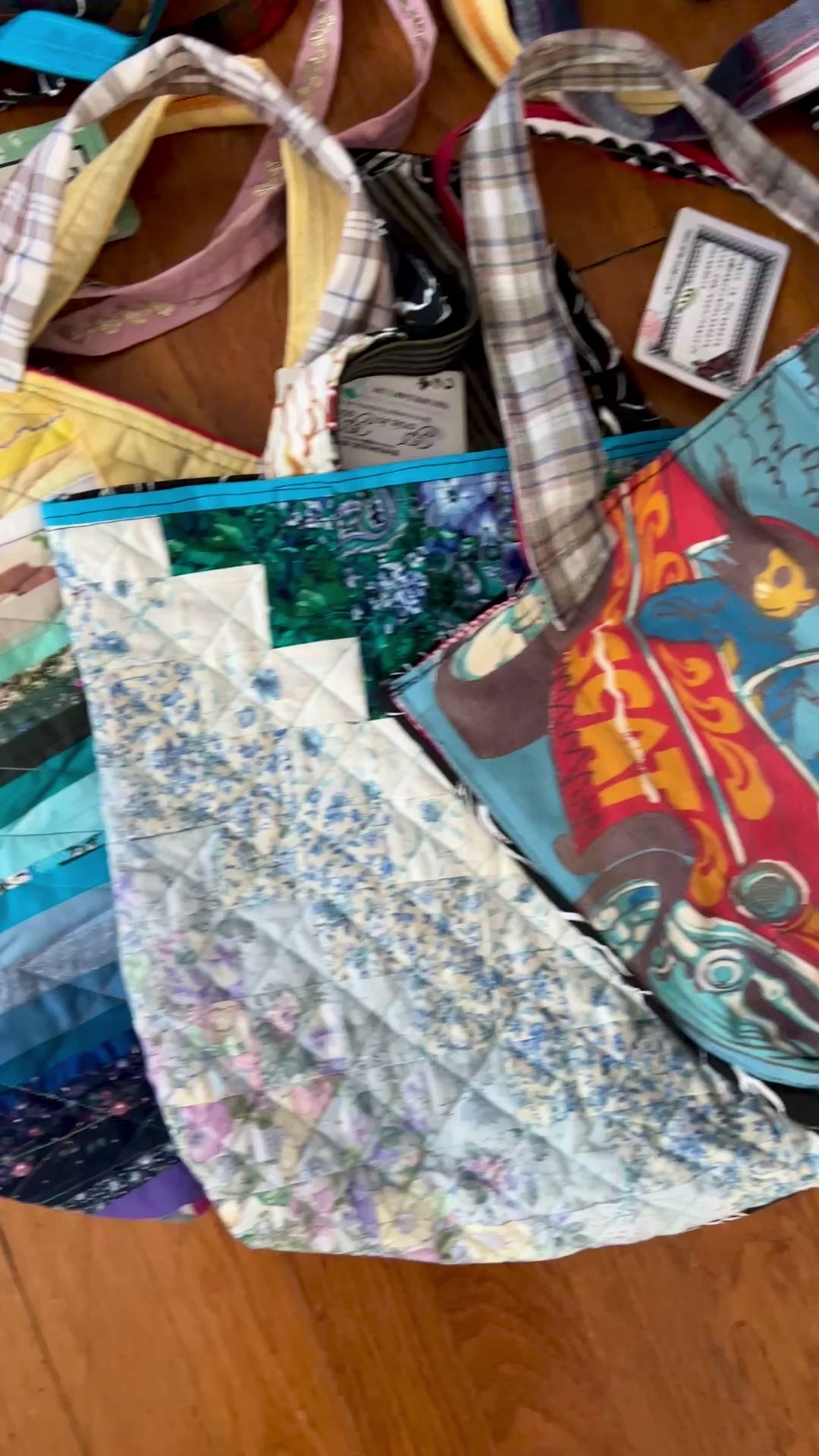 aerial view of quilty tote bags against a wood background