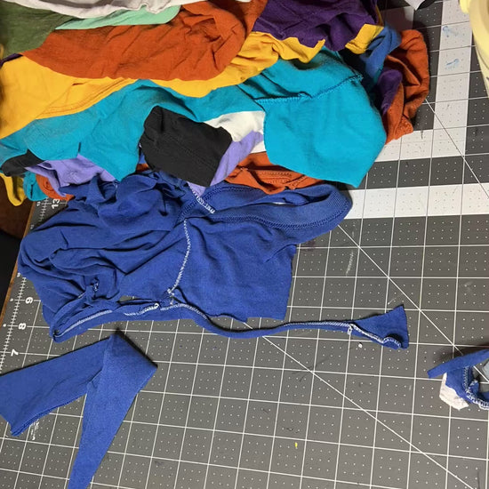 Cutting up tshirts into strips, to be used in rugs and trivets