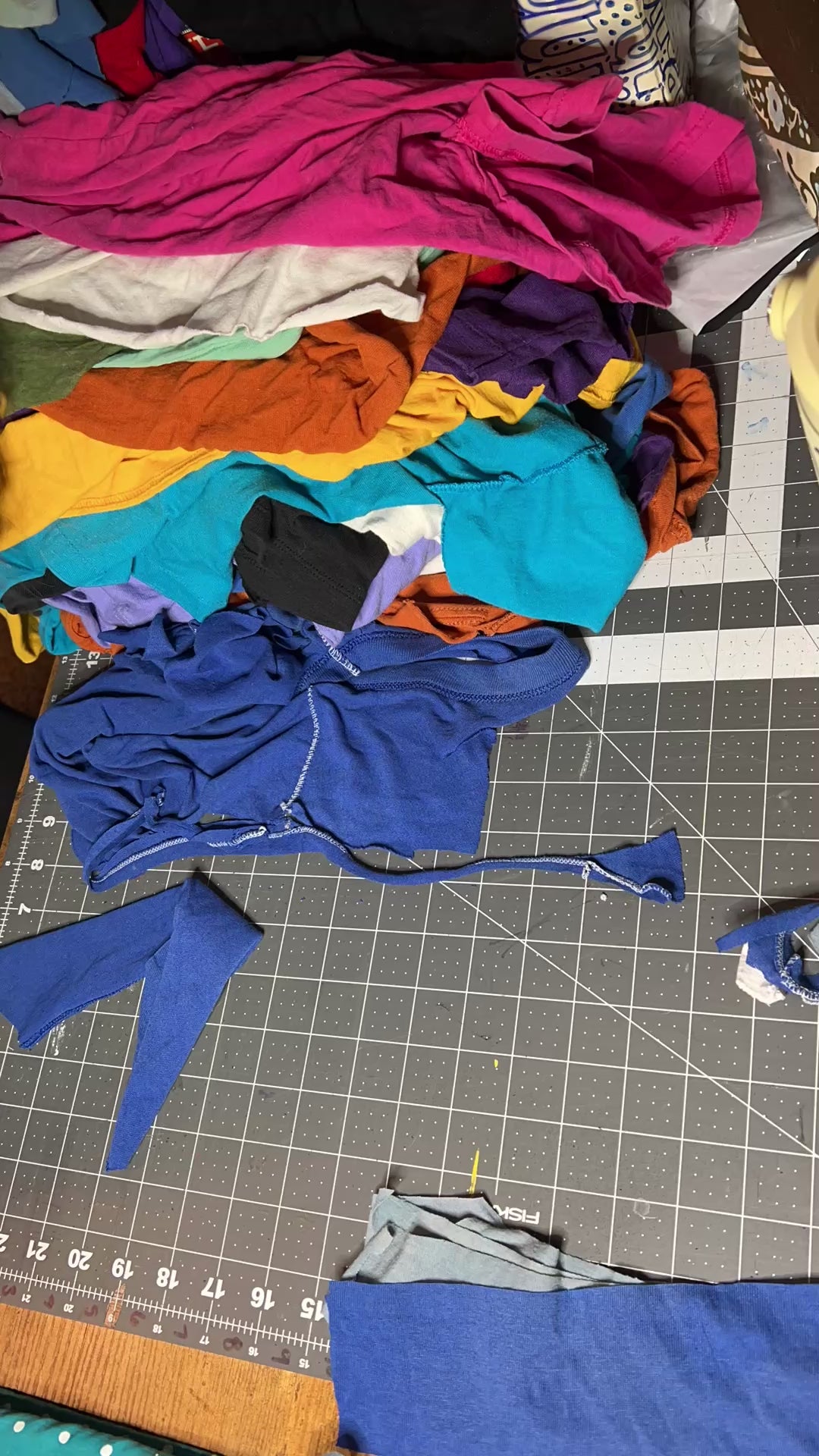 Cutting up tshirts into strips, to be used in rugs and trivets