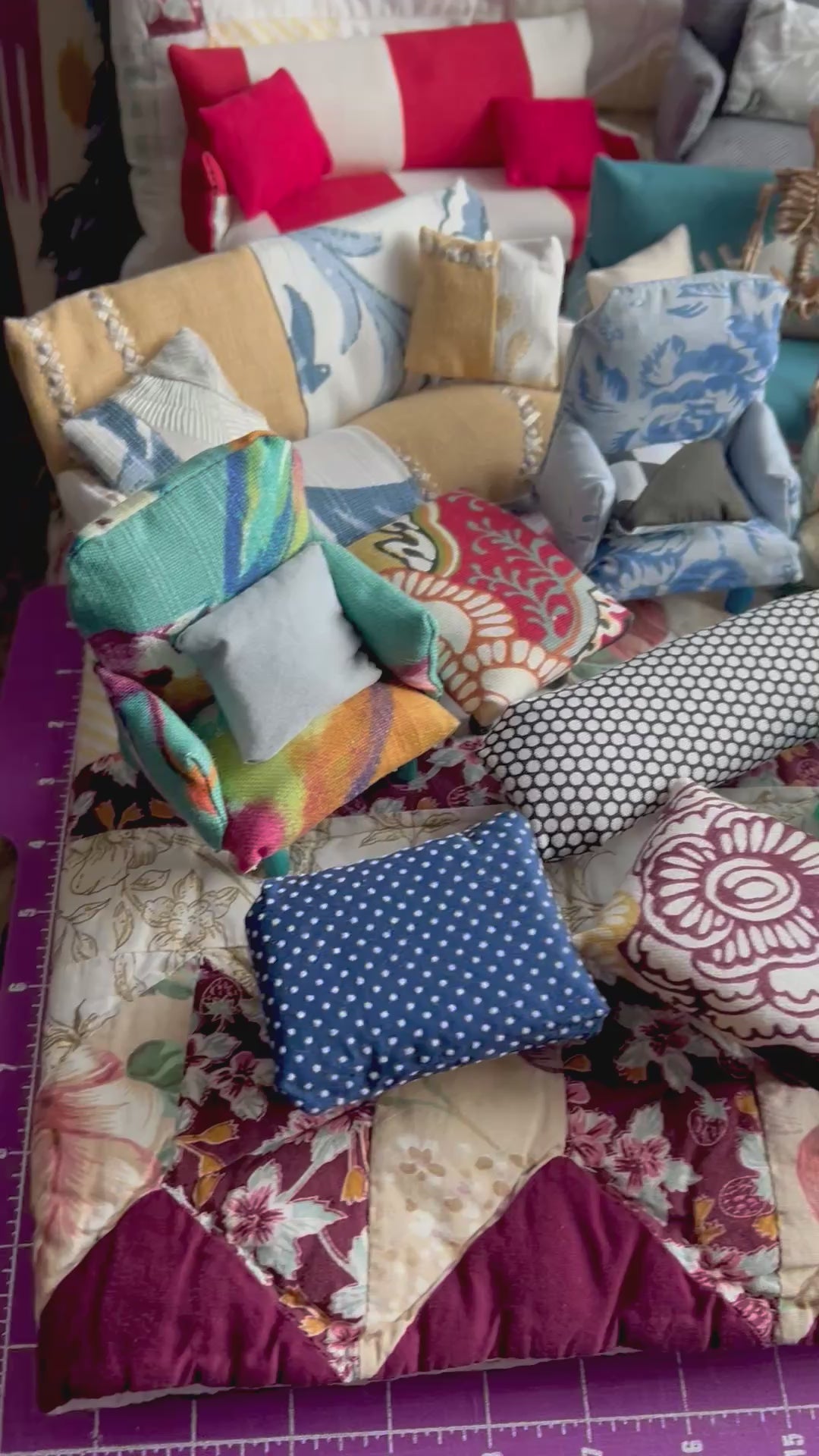 Various miniature couches, chairs, and ottoomans