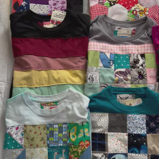 Video of various tee shirts, all with handmade quilty designs