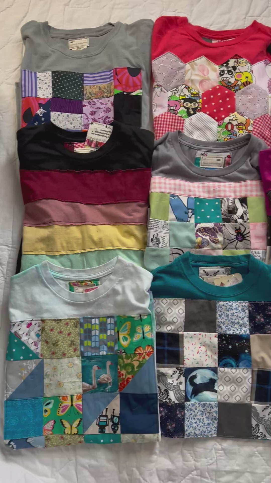 Video of various tee shirts, all with handmade quilty designs