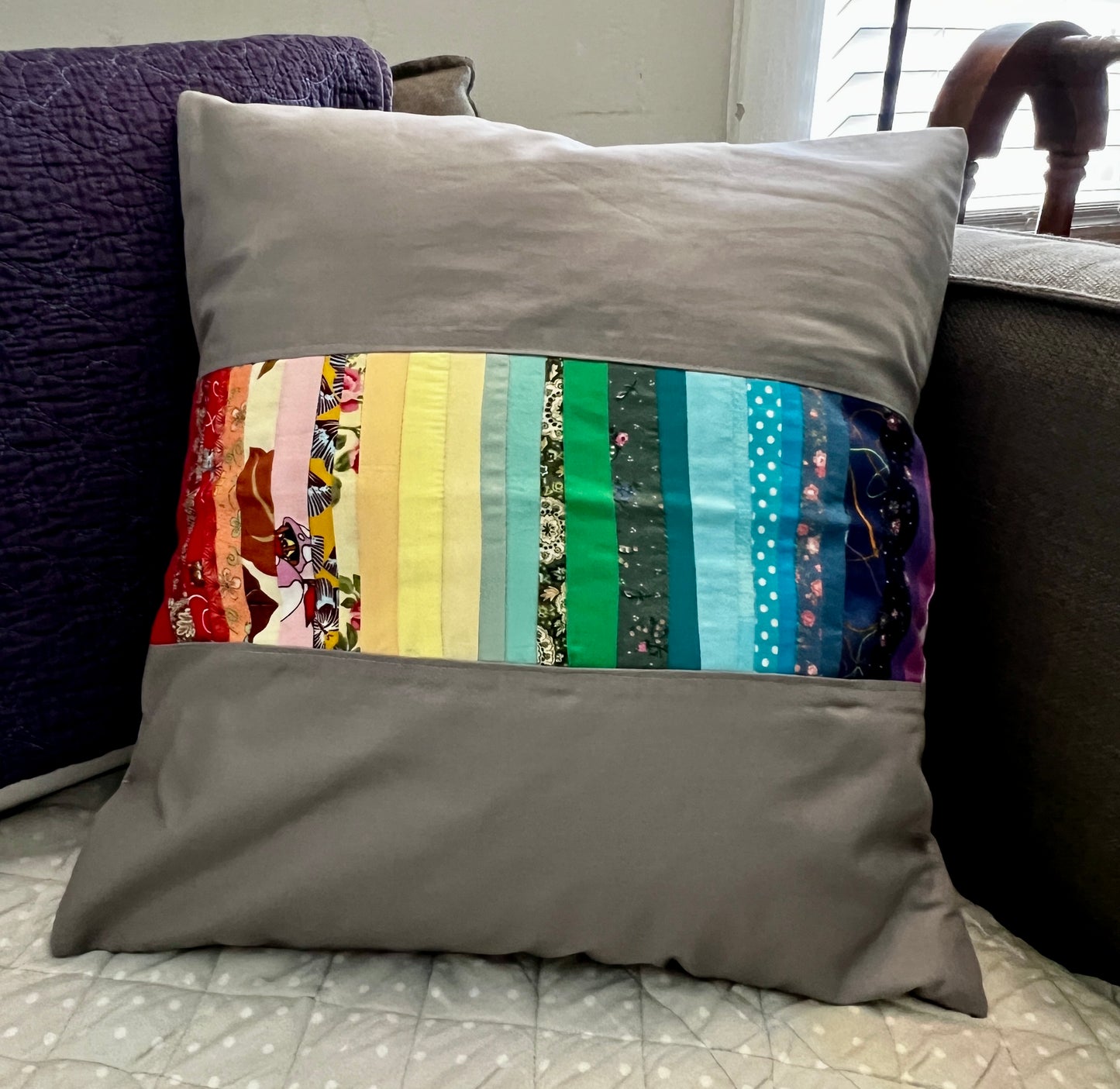 rainbow stripe pillow cover, created from fabric scraps