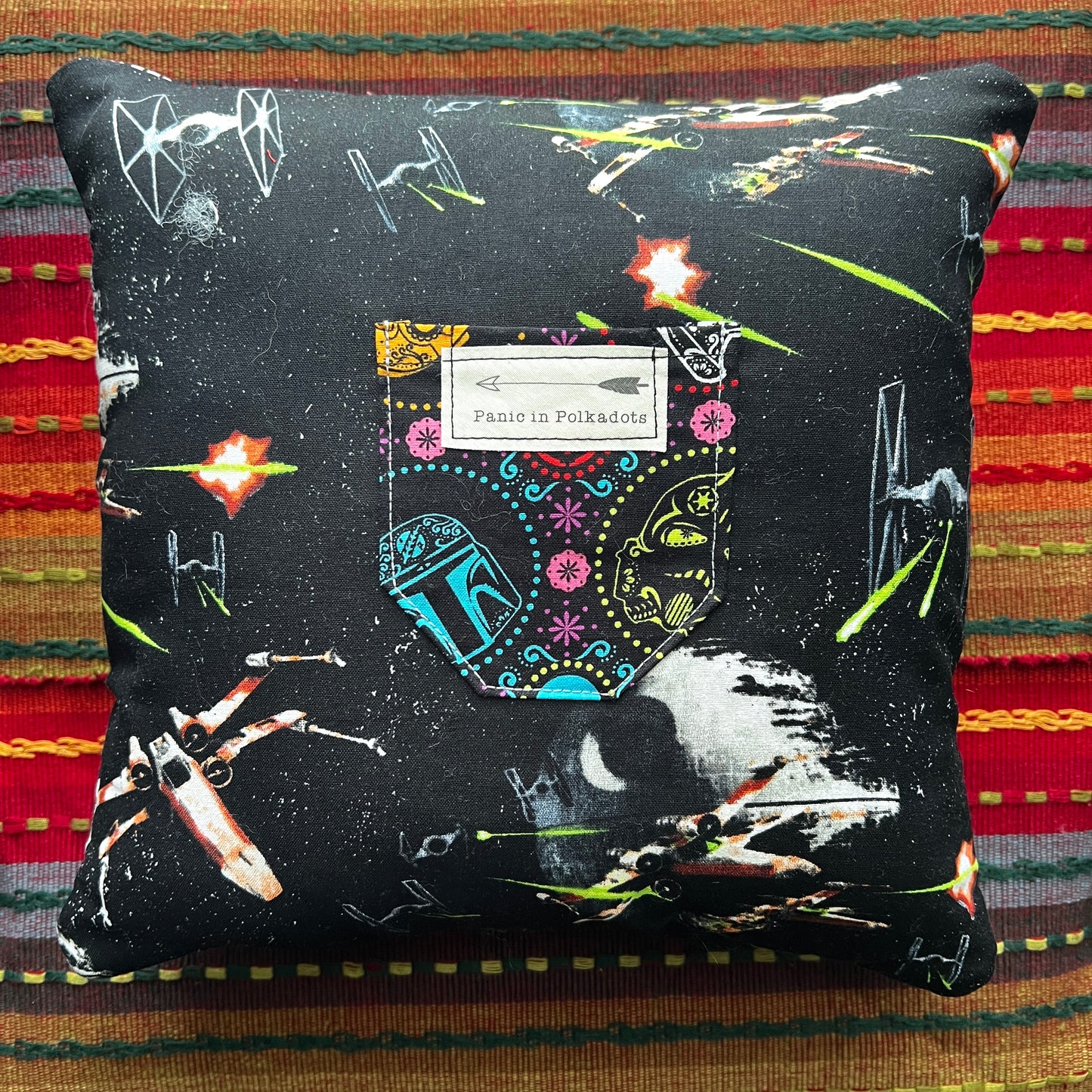 back view of retro droids cathedral square pillow, with space scenes and boba fett, storm trooper pocket