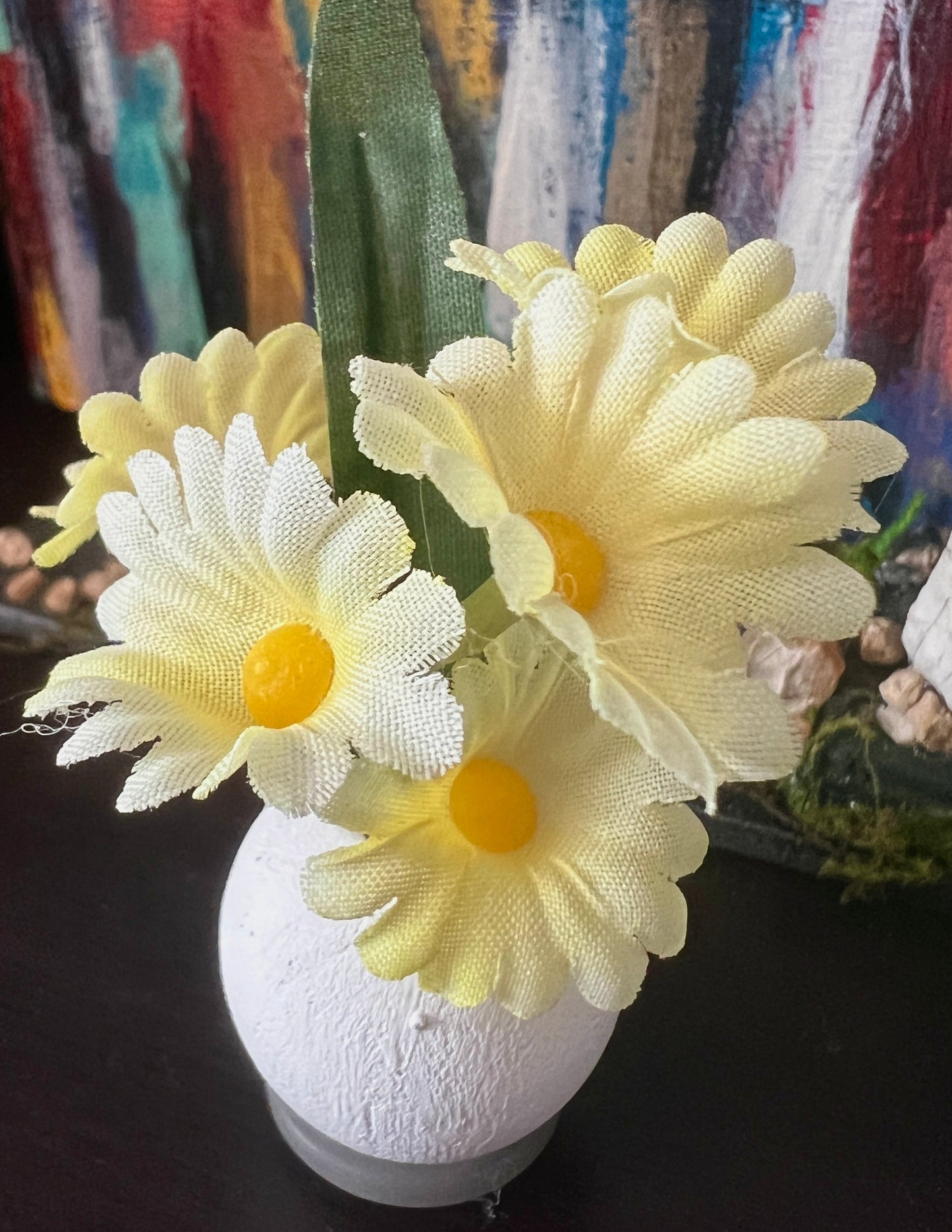 white vase yellow flowers